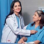 stock-photo-indian-female-doctor-using-a-stethoscope-for-check-up-on-bed-at-hospital-2313987685