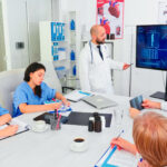 Mature medical physician explaining treatment to nurses during healthcare seminar pointing at digital monitor. Clinic herapist discussing with colleagues about disease, medicine professional. SSUCv3H4sIAAAAAAAACpRVy47jNhC8B8g/DHQOEb4f+YJc9pRjkEOLbI2FlUVDkjcJBvPvacl6j2cXuRhWd7FZrG4W337+6eWlKKGvY/Hby9v4Rd9109z7oYOhzi2F+S9zvMM2YbePfOuU5fsApnrIXQ3NPljCEC8tXJGC7b1pxvD7lCz6AYZ7j/1u99slDznd2xGtlhLXOna5H3L8eiNulBFrhsLTklN0JI8NXrEd+n2l/nIfBuymWhSXbknccpvMIZI6hGs/1BPxLSyk6qpDpKxfH9xGHvvNEt5yX2/8tiWQcokfSUAD13+PtOp/BpgiO9kiDPhKOh+EW9r45+P7ZUlMSVpBqeJ3hGa4ROjw1y/Uq0iNmjd6iHMvR9SXuo/YNNBiJrGX/GPvTwr/EWtsI/6Pao8/f60nf6X149Hf3ncH7aiF8JiP+ViFdDElZwQTRgHTyAXzgZdMJWNUsloEauPaAJeiUUaxyvDItEVkHirBuPdl4FEnrTawcJXVySMTCQ3TXJUMvK2Yj1wEjd6ATRvYCqs5VY4aAlWuLAs2EhgjB1QqSKNWsKl0aYVOLJqKKpvSU2X6QUhc2RhCNHoF26SNE8EzGUERDcnpgC4xUE7IVEoQqVrBntsgnYxMmohEoyTOCTmLZSlEkqbCYFew1KAAuWWVN8Q5eCDOfCrPUYQYIsAKVshTlNIwVI4zTbqyUurIjOTK046ANqxgUCYa4yrGXRjVSJoFIDCvUAsZgjLJTa1/9Lv4+jfdwes0vXOn4Z7qvJvmb5mGc7q5u3G4dXWs29fdsjxcJktalsV8b4dunKNiJdfkfIOyGW9xRTVxiV+g7wmelvj+gpEB5utunzYP0xTOVYtEN3D8FEoaHYTw3nBhSSlR7J3tUlOdic5C8H5rMnVo3HS9Rk/szXJPc2vDYqIfnG4CuCDsHnAyvWegk/89gyxO+Cx38MQJoA3dlA2wuOOz3Nknn2HOljljjFy8/WyeI8AKp6XZAWYbpVyQWtNt2p1uNtQ557V4pBZ7G23rWpNGxxbtnyVaSgbEldOfiHbie9KEPOqHmhwwz0Q/Ap6L5qz6fuO1VVb/YIA+aPtEfKP1ZwKTXSwCH959Wl+nw7s/C1gIbZQPym72uehHQsBr7iMhSREqLDm3fnOhs5aF5lxxoZzcHoS9lIXkhuxJ8s0iz0oWWlmvnDF8hZyELIR3wVhyfLdCPghZCOO9Em6rcpBxJOoUCba9AouKhROCngAnJvuc5avH2SwqWVYSyPYDd5Lpkn7KIICBKAWi9r6KFa16/w8AAP//AwA2JvBW5gkAAA==